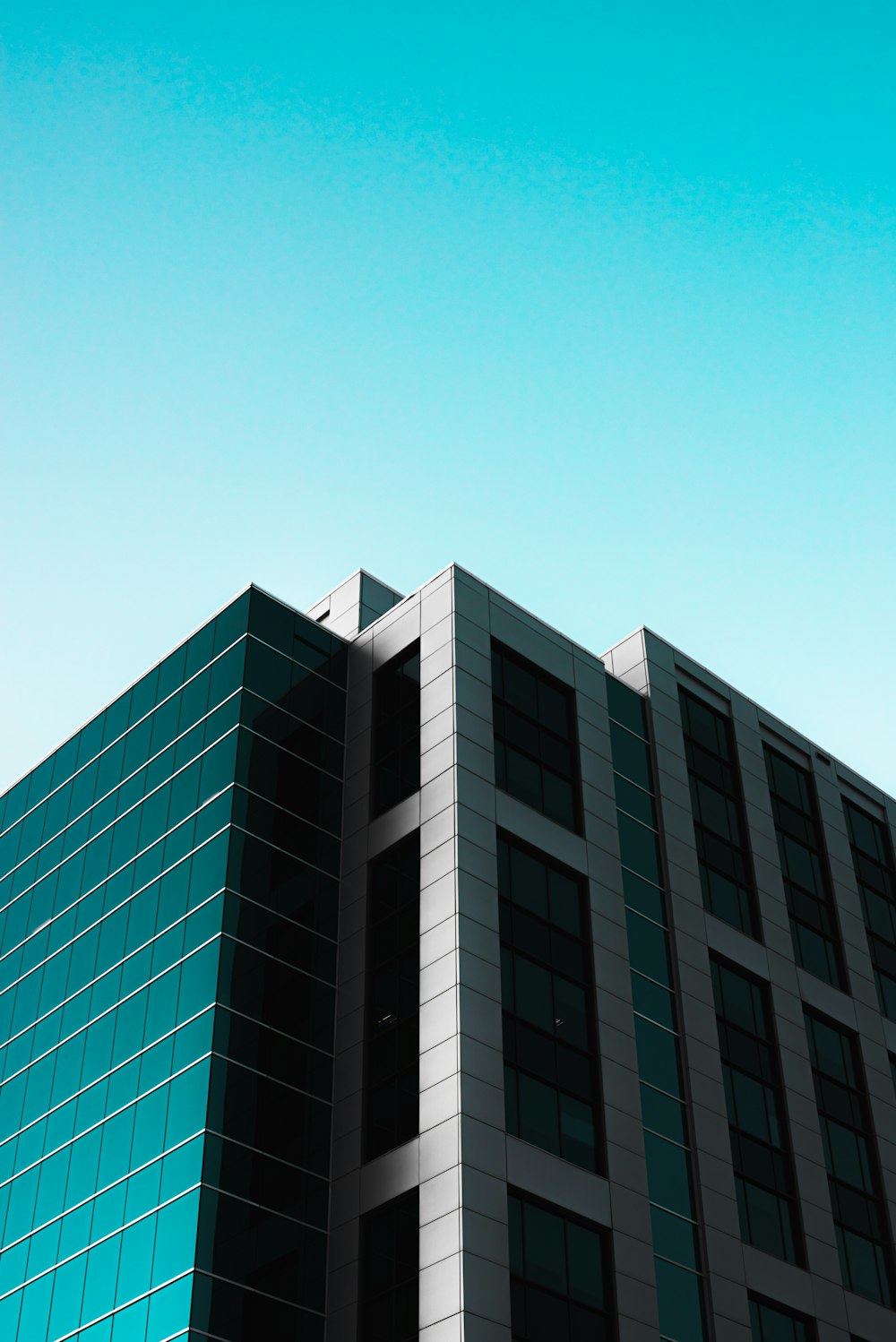 green concrete building under blue sky during daytime