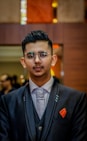 man in black suit wearing sunglasses