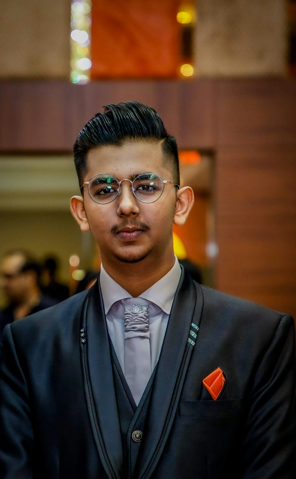 man in black suit wearing sunglasses