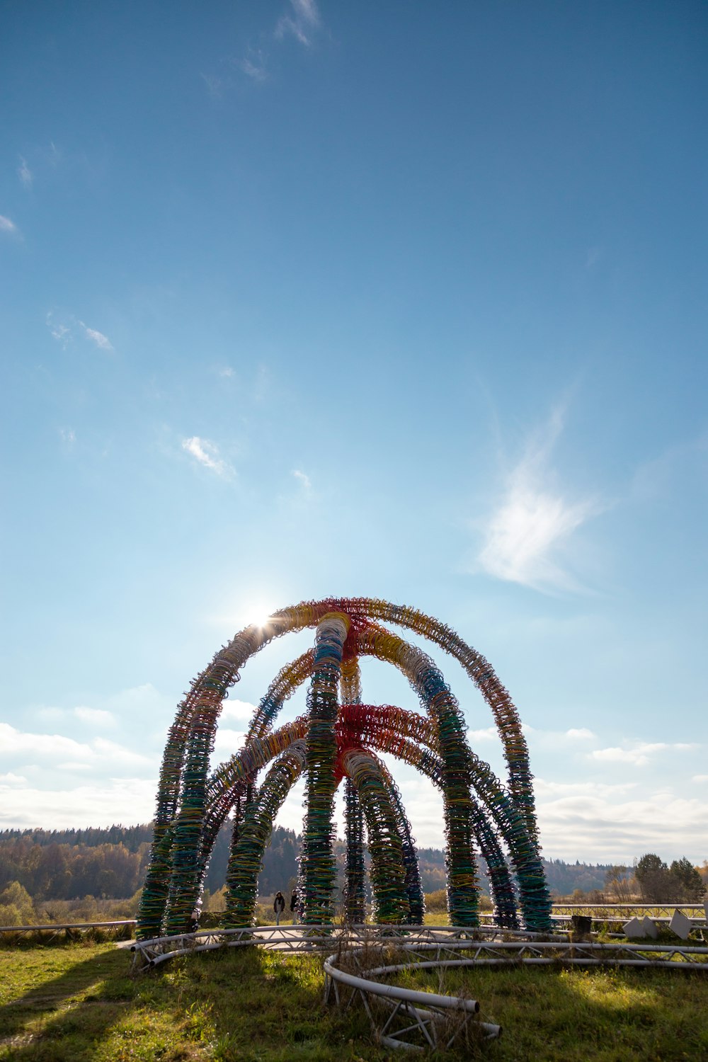 red and white ferris wheel under blue sky during daytime