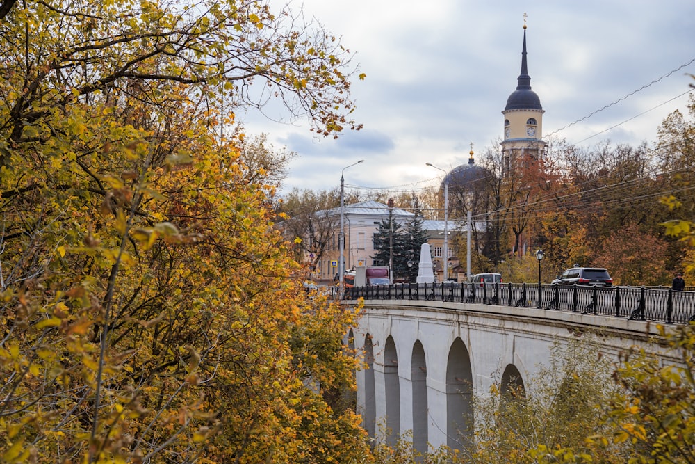 a bridge with a clock tower in the background