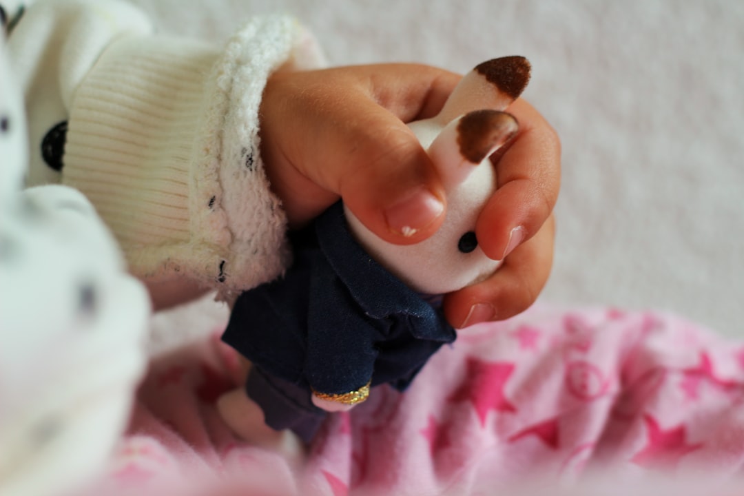 person holding babys hand