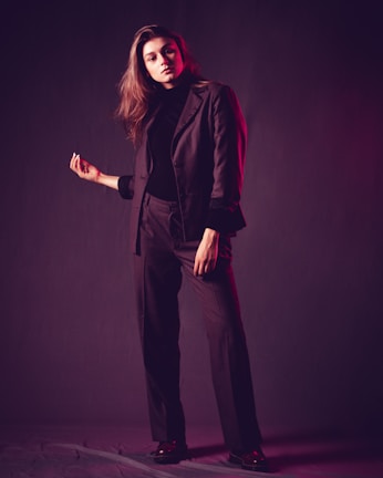 A sharp, confident entrepreneur in a sleek suit with a subtle digital glow highlighting their features.