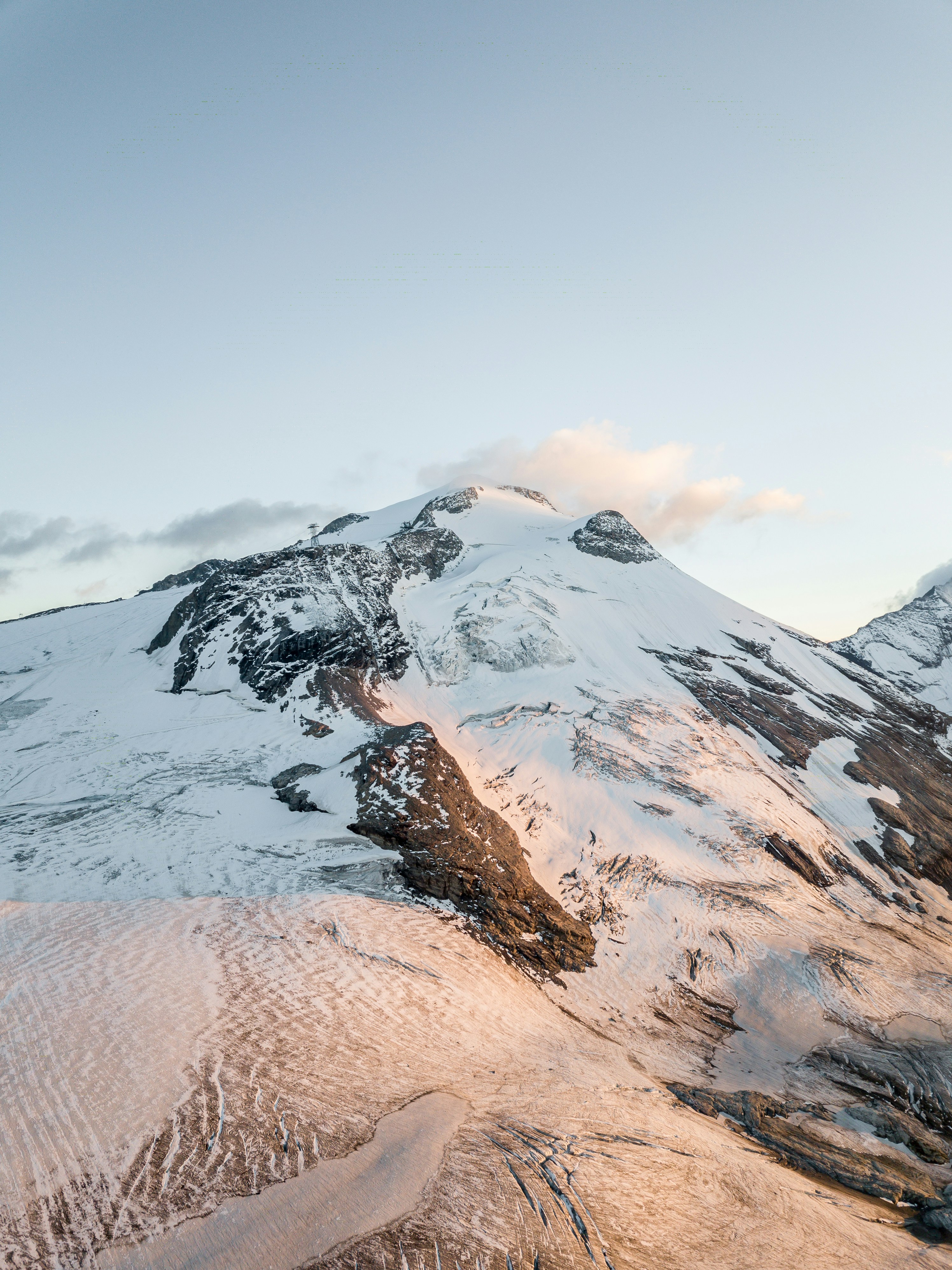 snow covered mountain during daytime