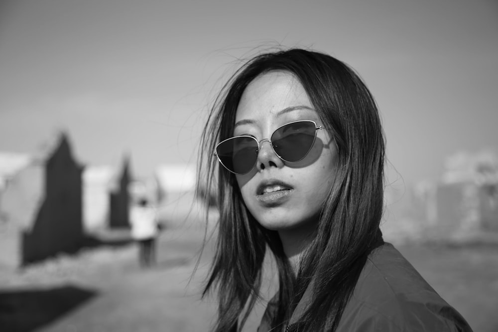 grayscale photo of woman wearing sunglasses