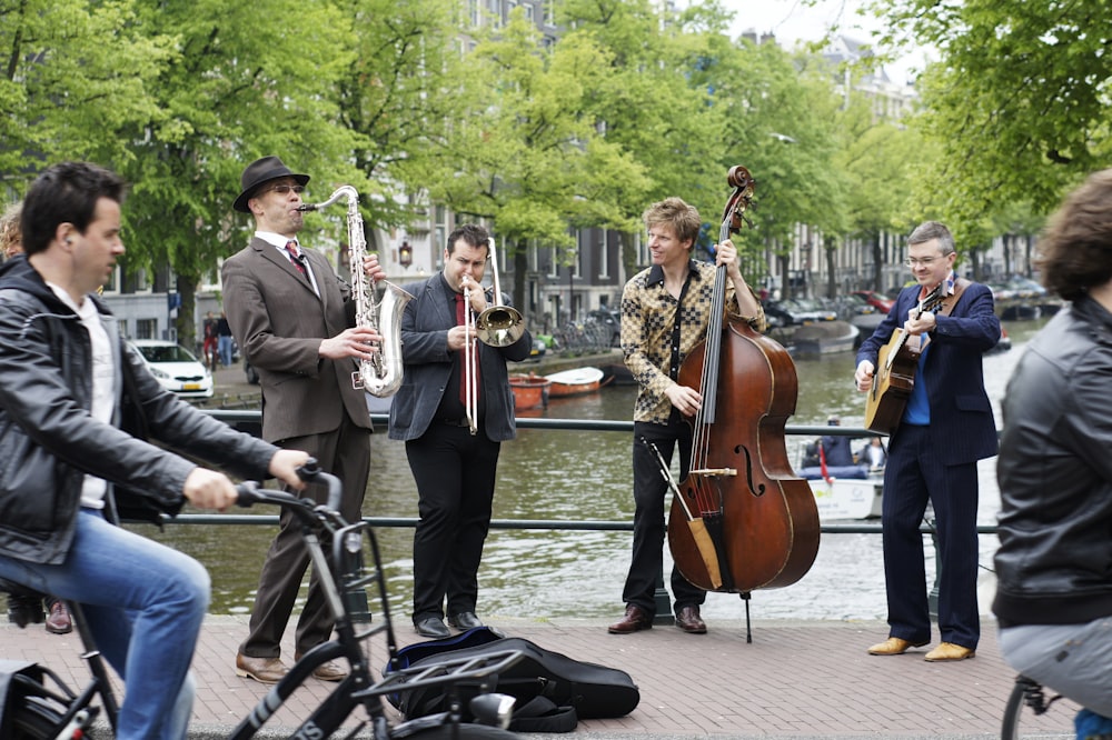 man in black suit playing trumpet