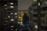 Night view of the apartment buildings with warm lights glowing from windows