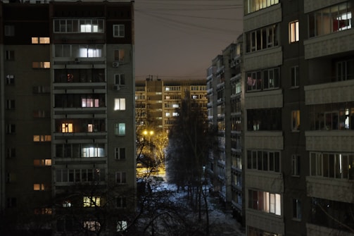 Night view of the apartment buildings with warm lights glowing from windows