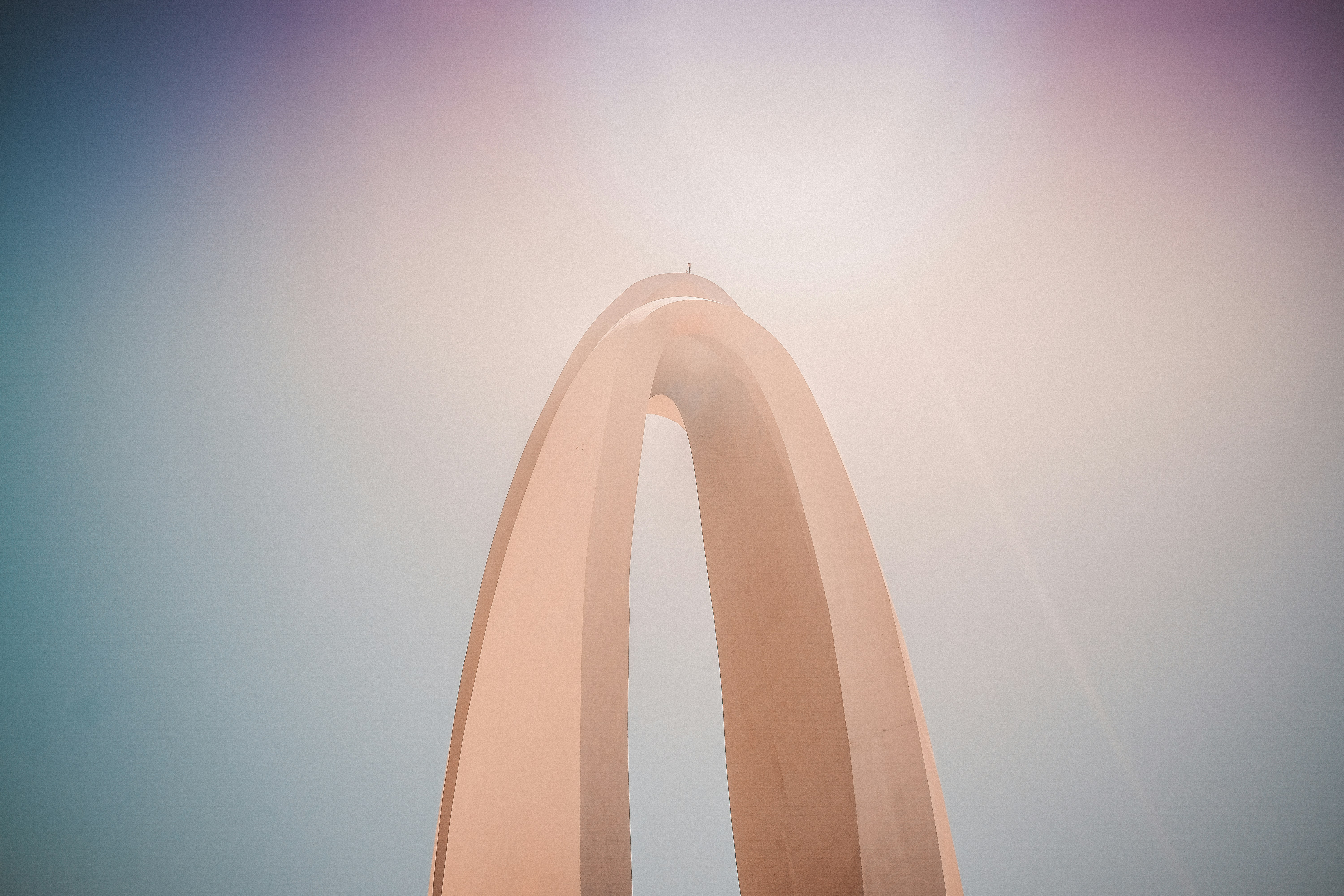 brown spiral structure under blue sky