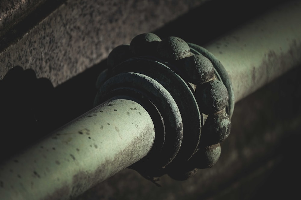 black metal pipe in close up photography