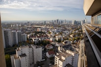 A panoramic view of a UK city skyline featuring residential and commercial buildings.