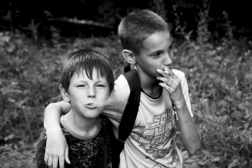 grayscale photo of 2 boys