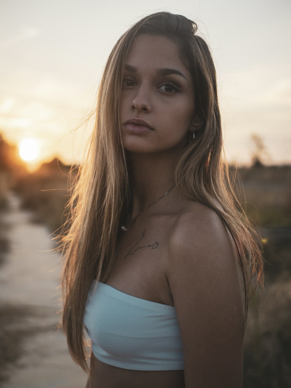 woman in blue tube top