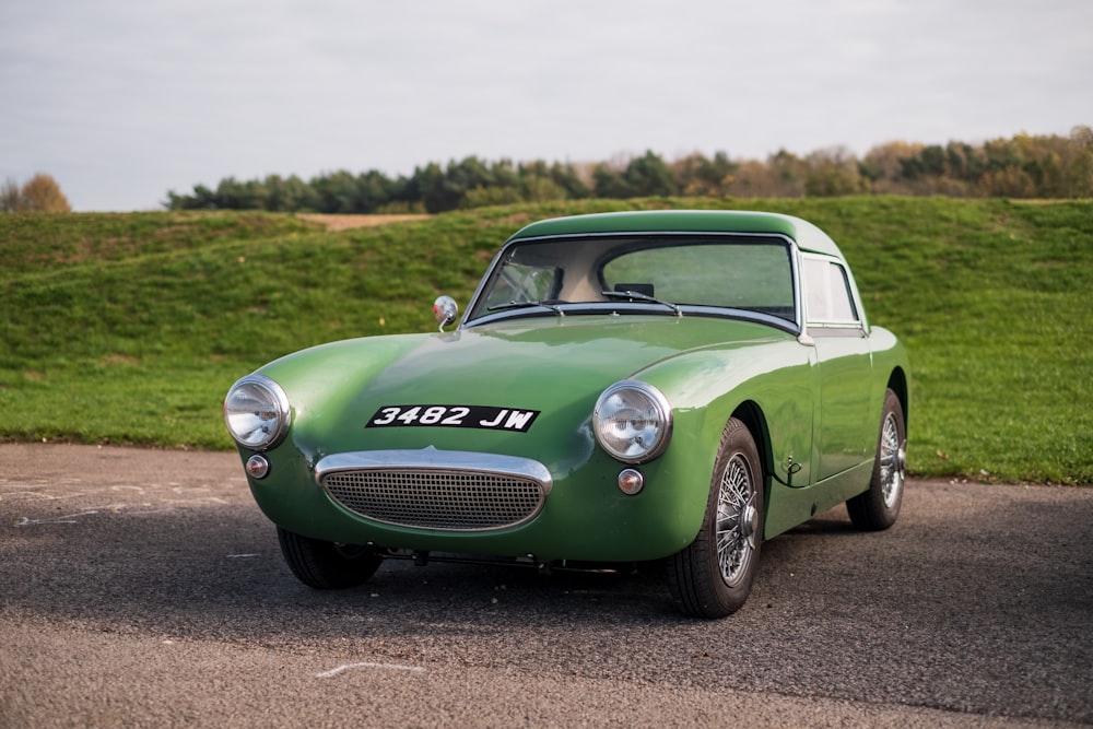 green porsche 911 on road during daytime