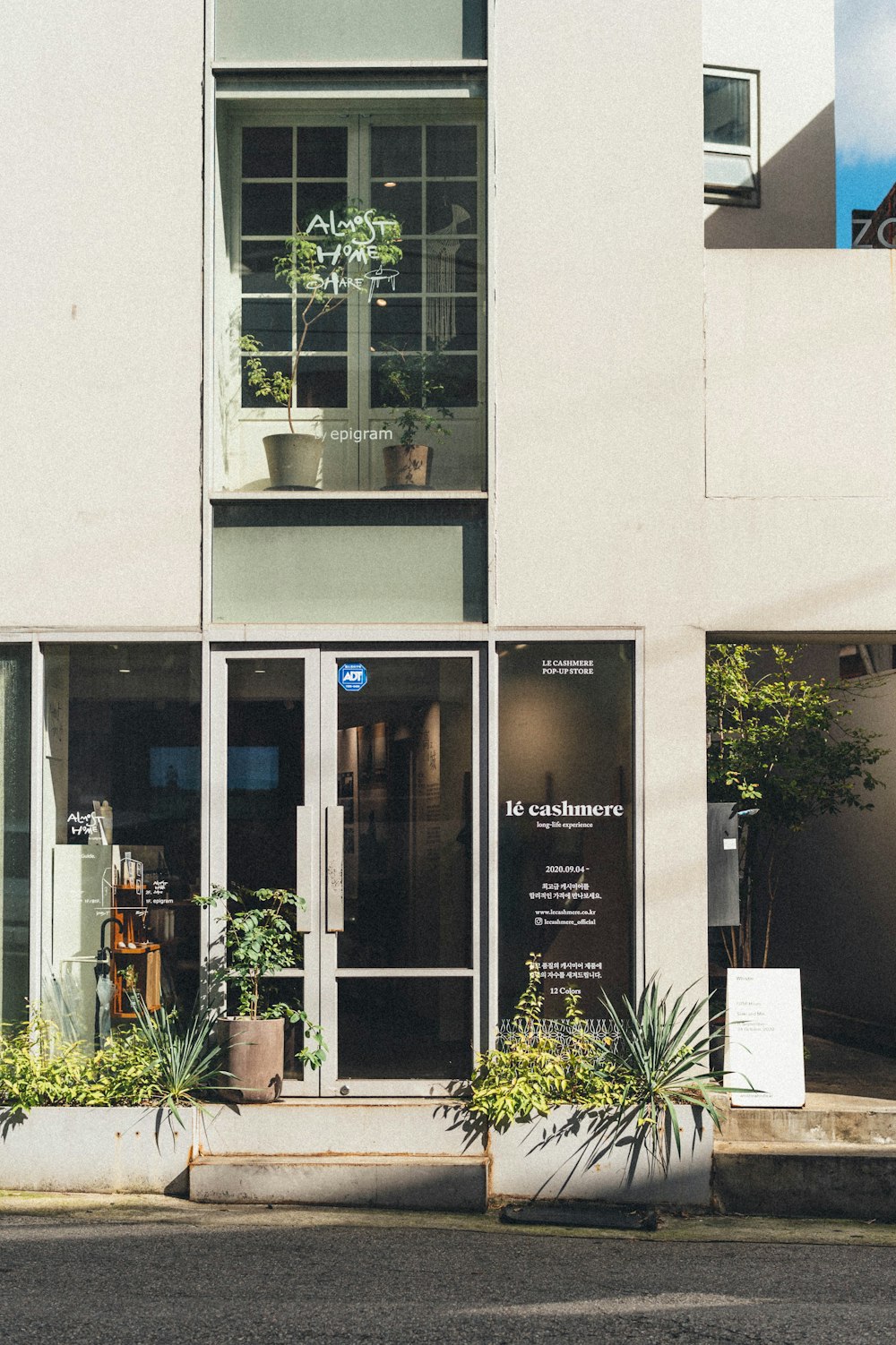 white concrete building with glass window