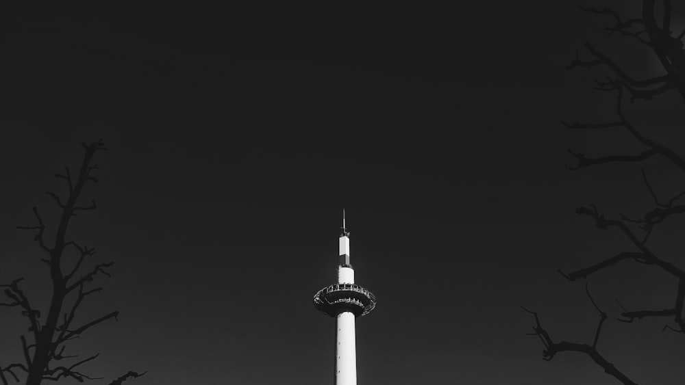 white and black tower during night time