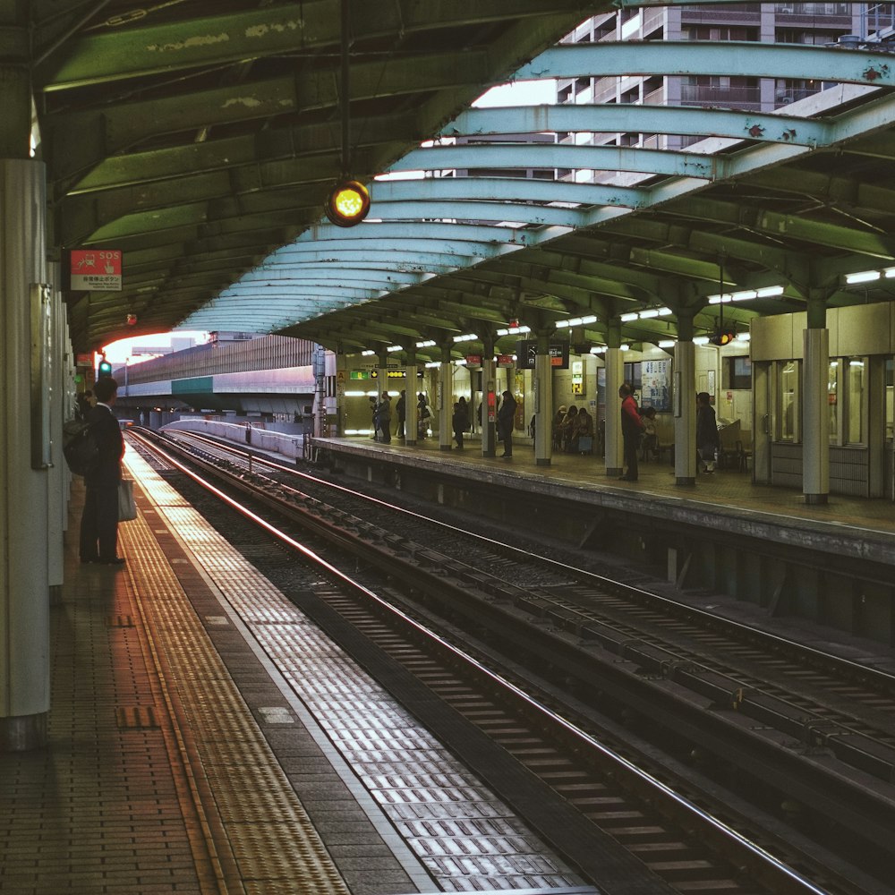 white and black train in train station