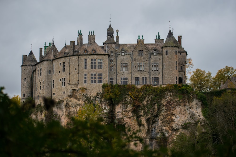 grey concrete castle on cliff