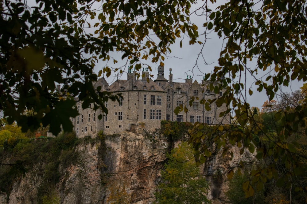 gray concrete building on cliff