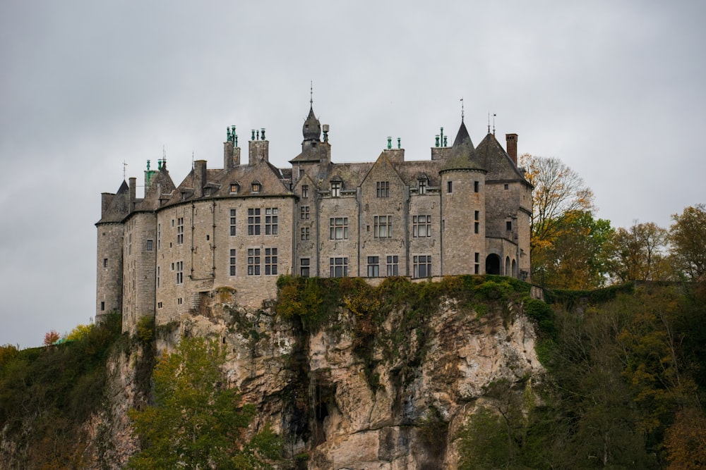 brown concrete castle on cliff