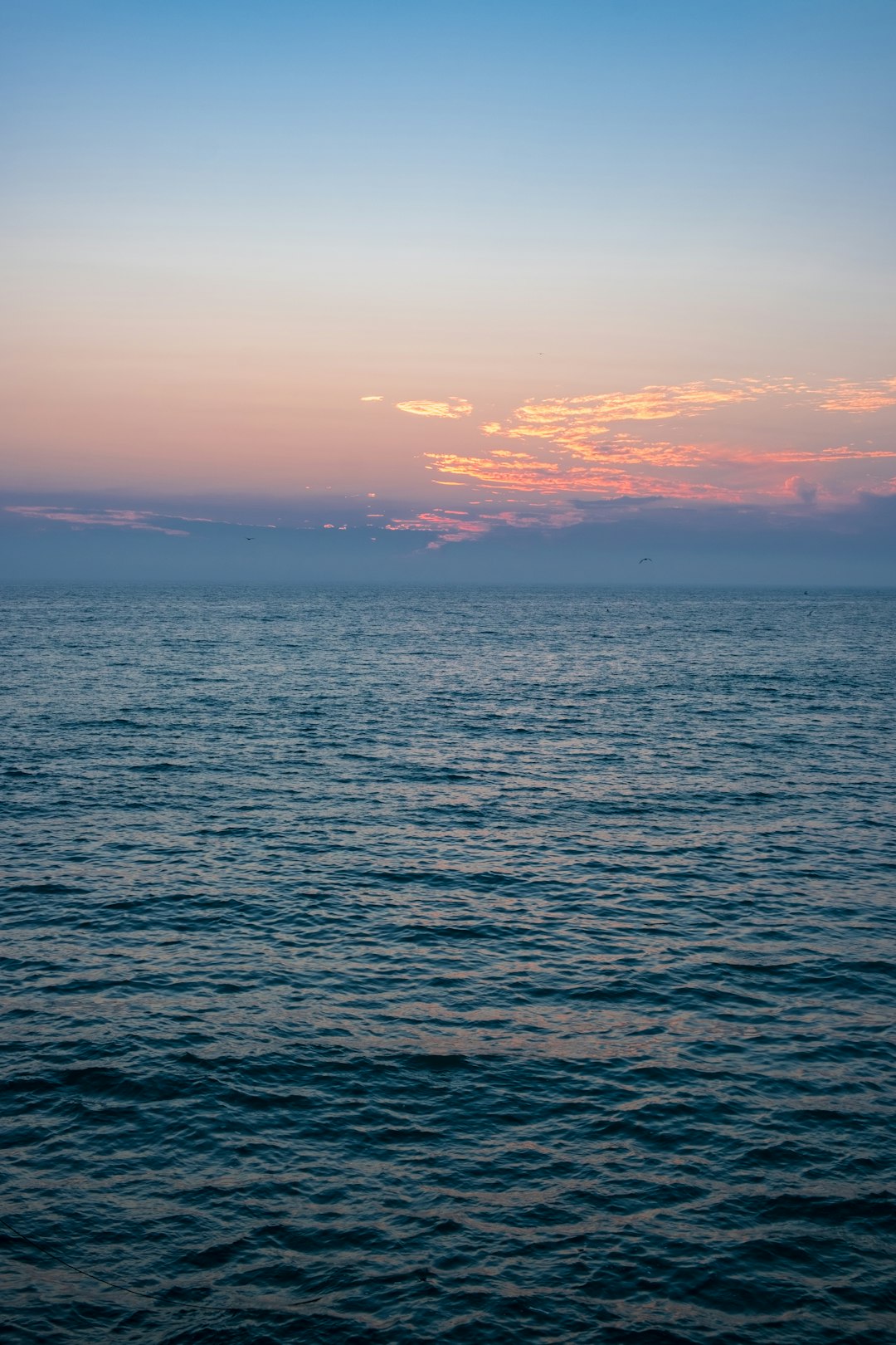 body of water during sunset