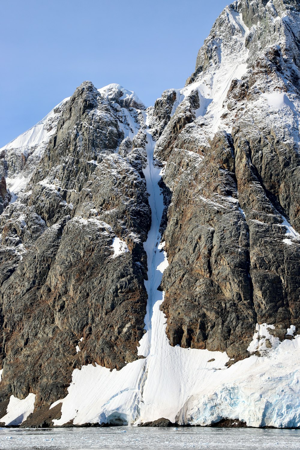 brown and white mountain covered with snow