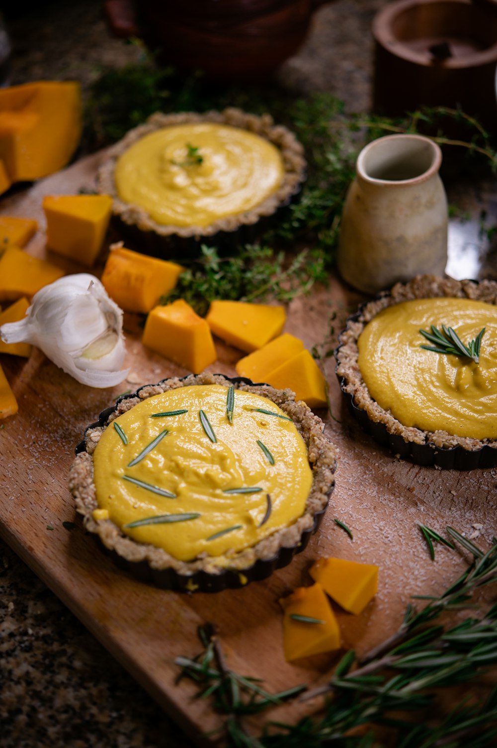 yellow and brown round cake on brown wooden table