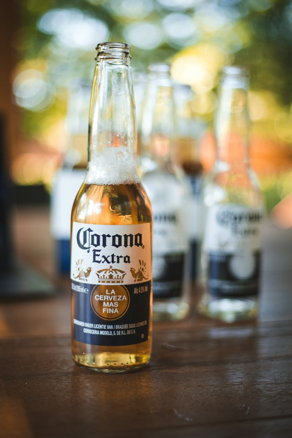 selective focus photography of brown labeled bottle