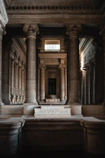 Neoclassical stone columns and ornate architecture inside the Palace of Justice in Brussels