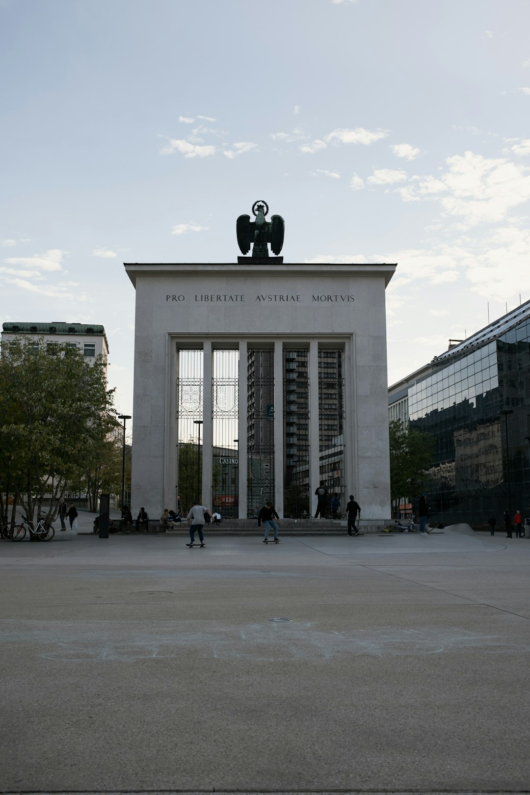 people walking near white concrete building during daytime