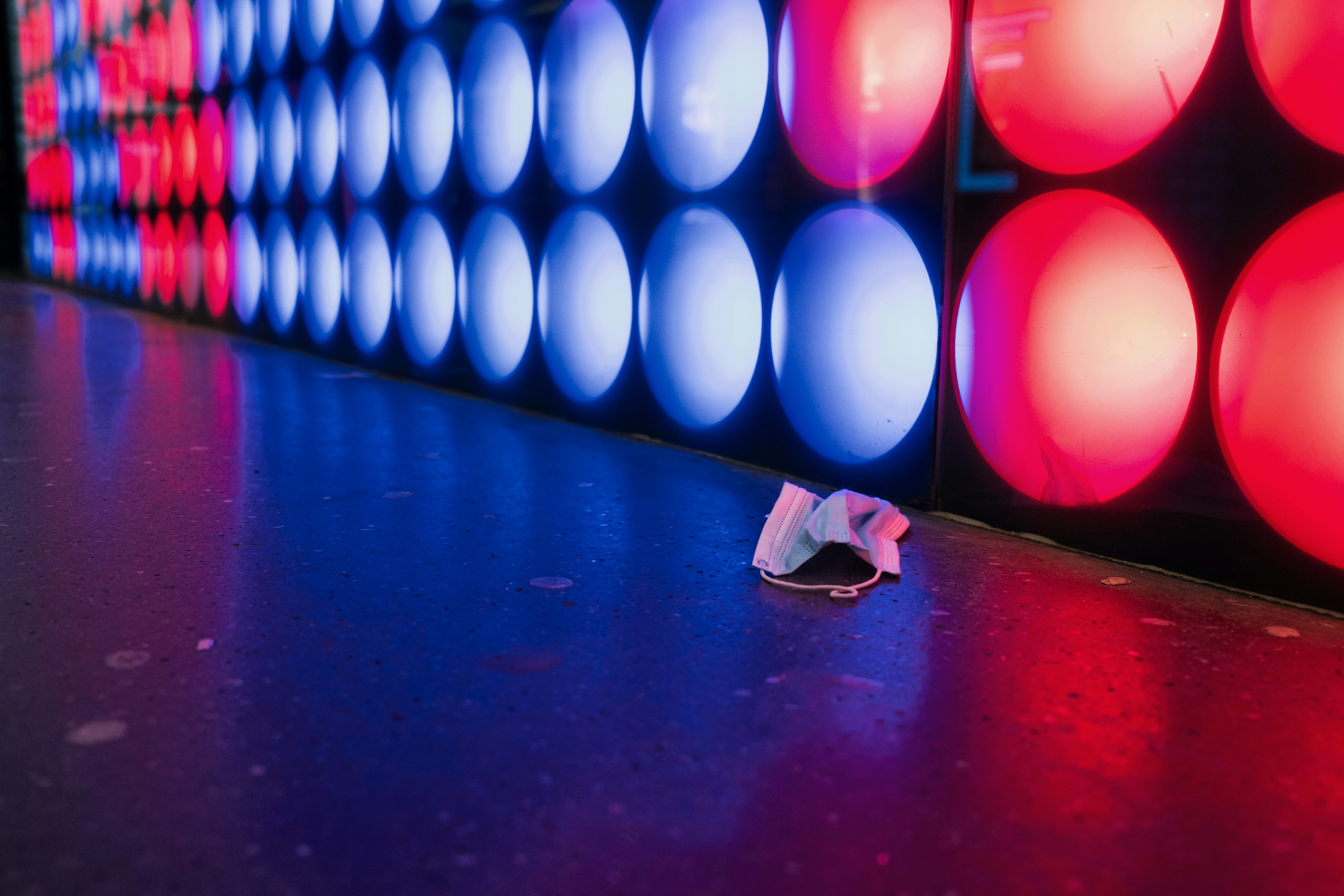 blue and white balloons on red floor