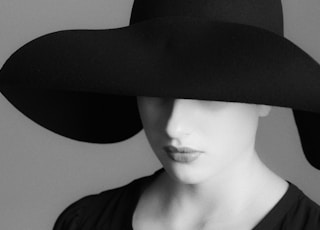 woman in black hat and black shirt