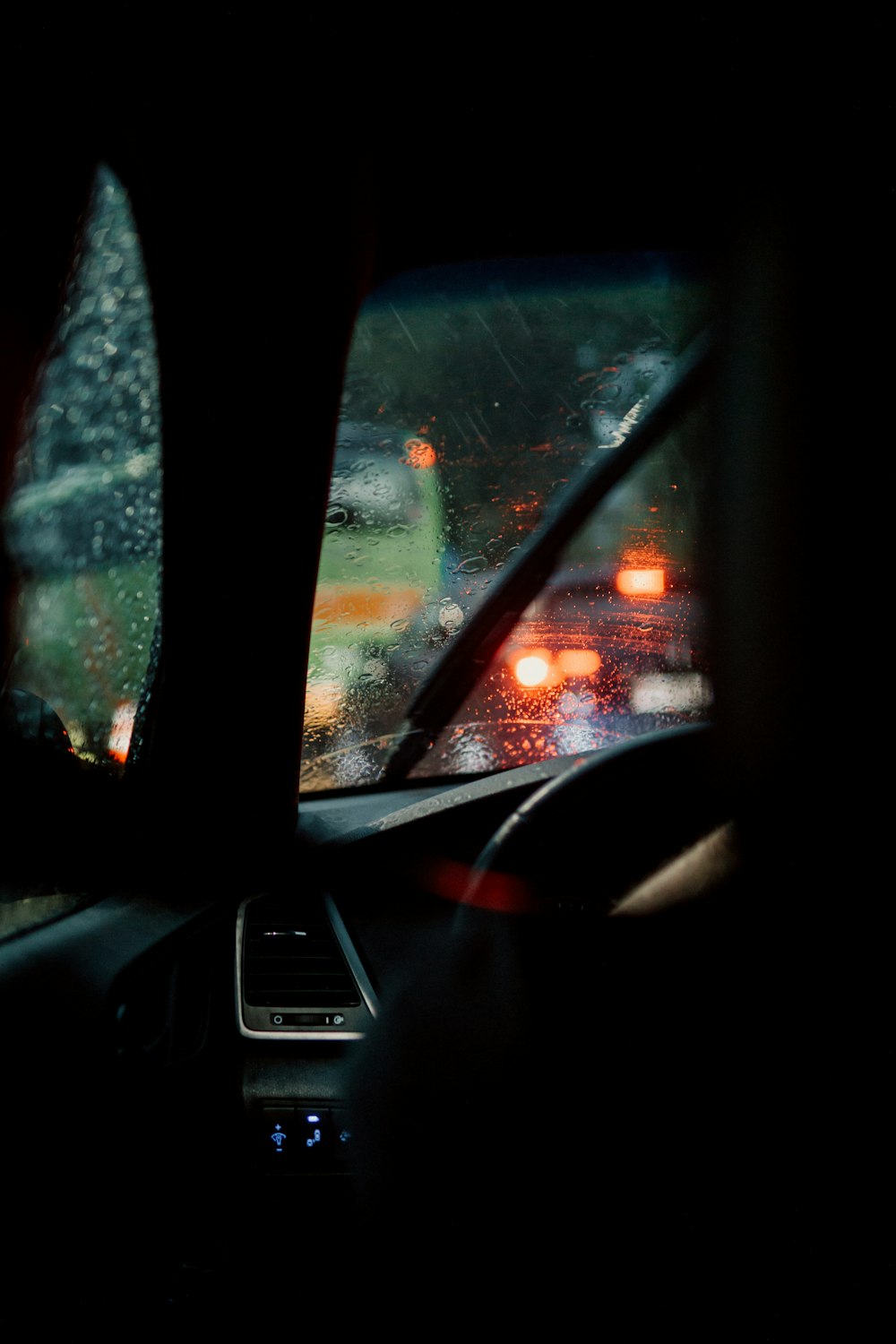 car window with water droplets