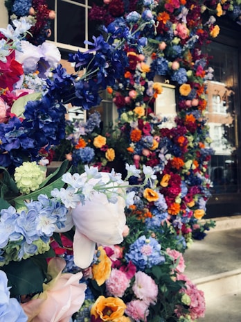 A close-up of freshly planted colorful seasonal flowers creating a welcoming entrance.