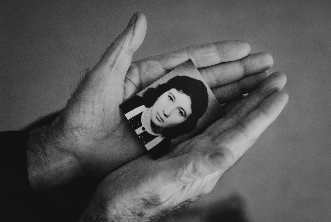 grayscale photo of persons hand