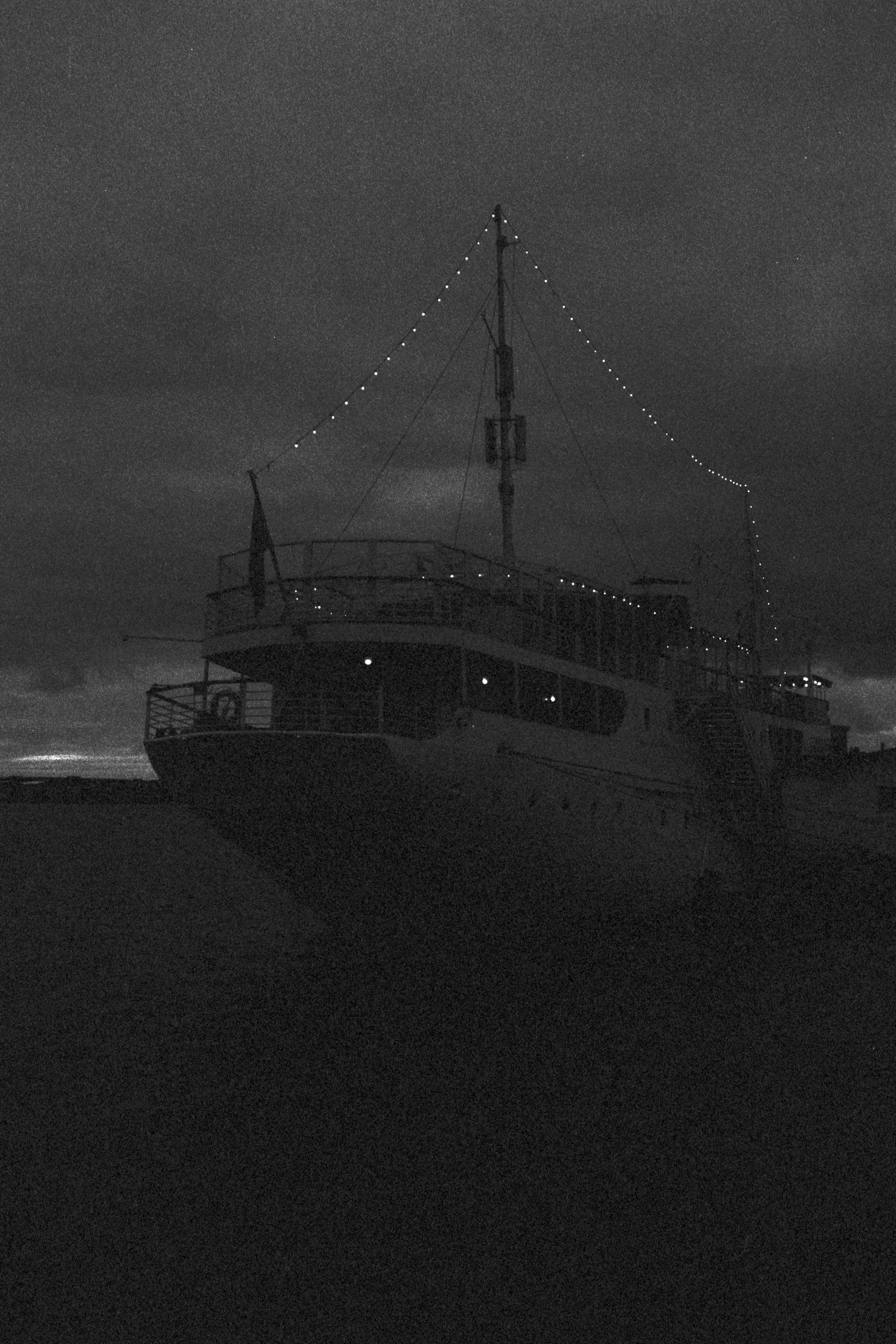 grayscale photo of ship on sea