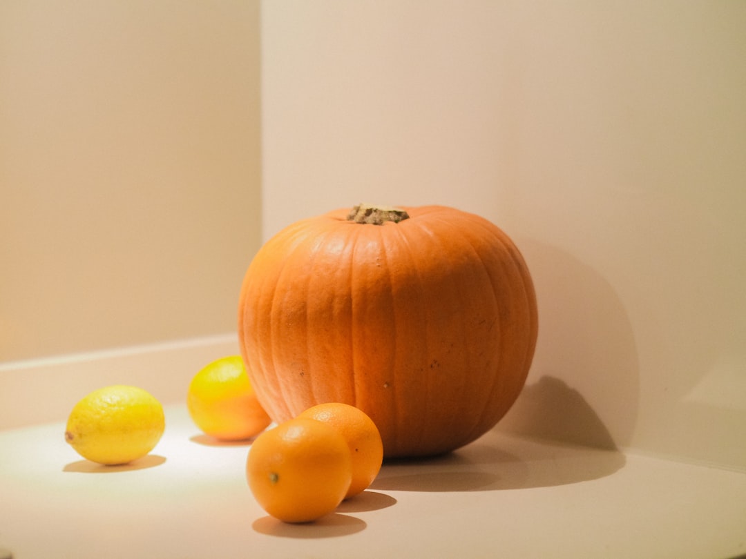 orange pumpkin on white table