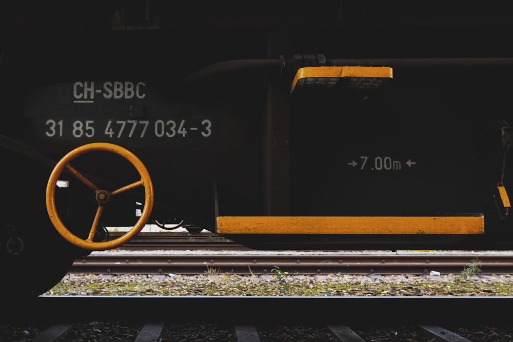 brown wooden wheel on train rail