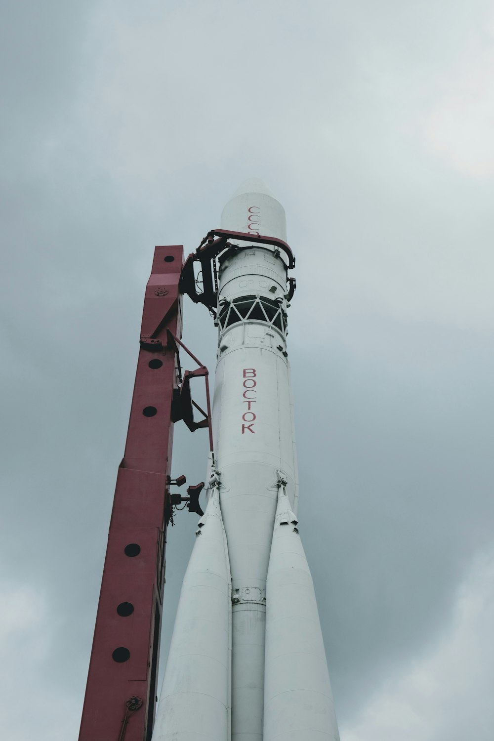 white and red space ship under white sky during daytime