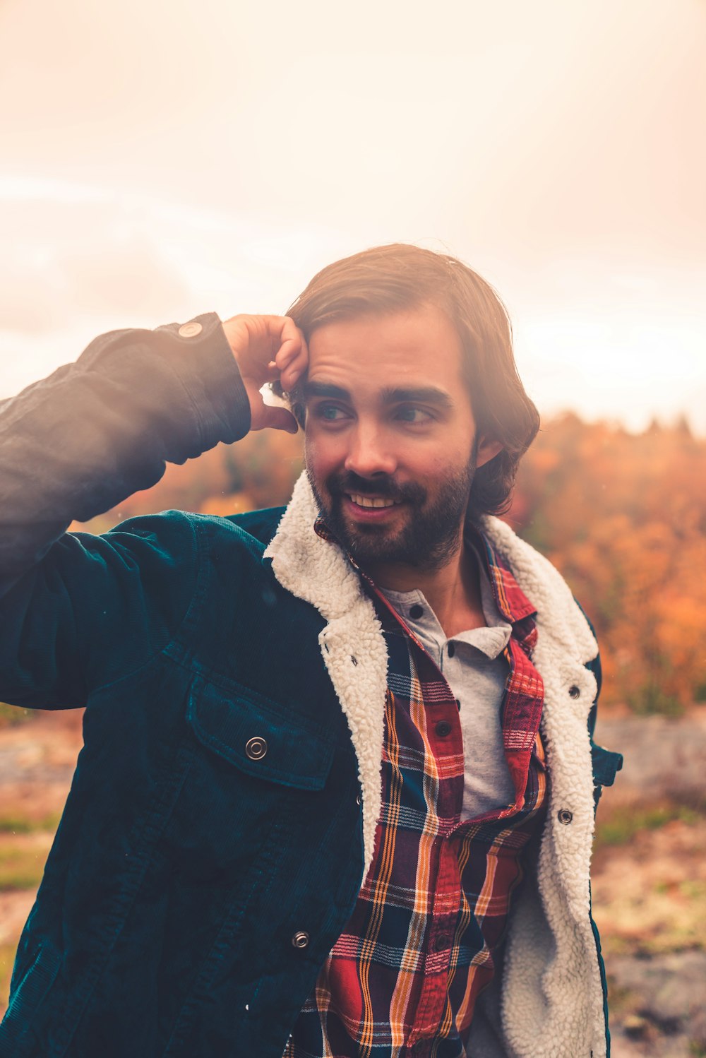 man in black jacket with white scarf