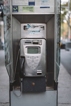 black and silver telephone booth