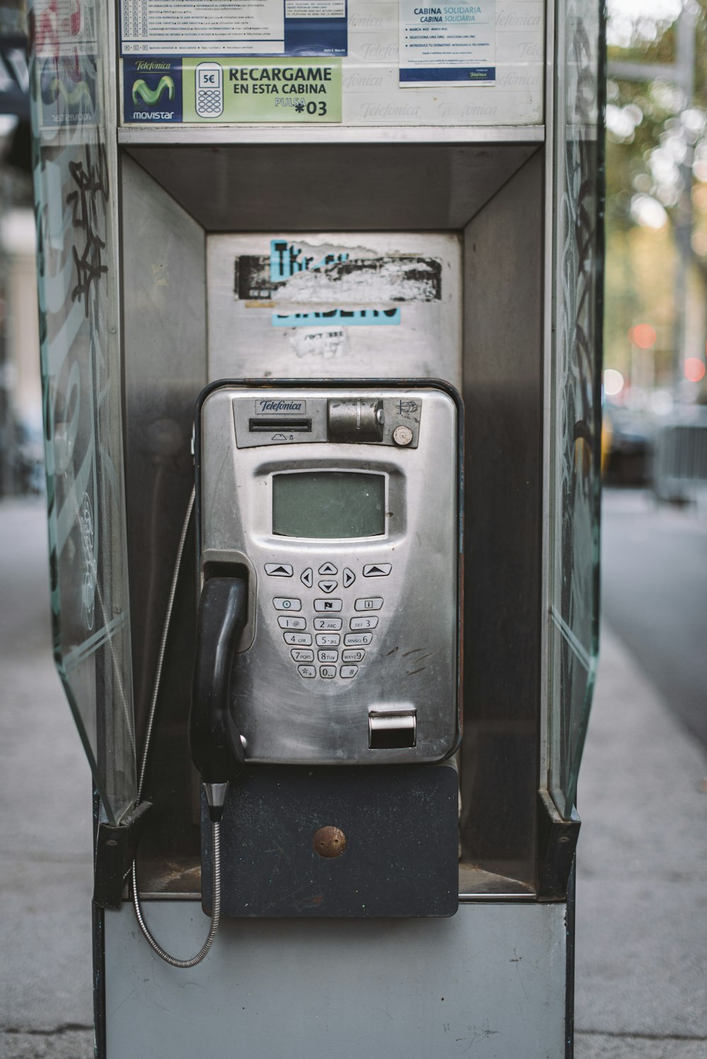 black and silver telephone booth