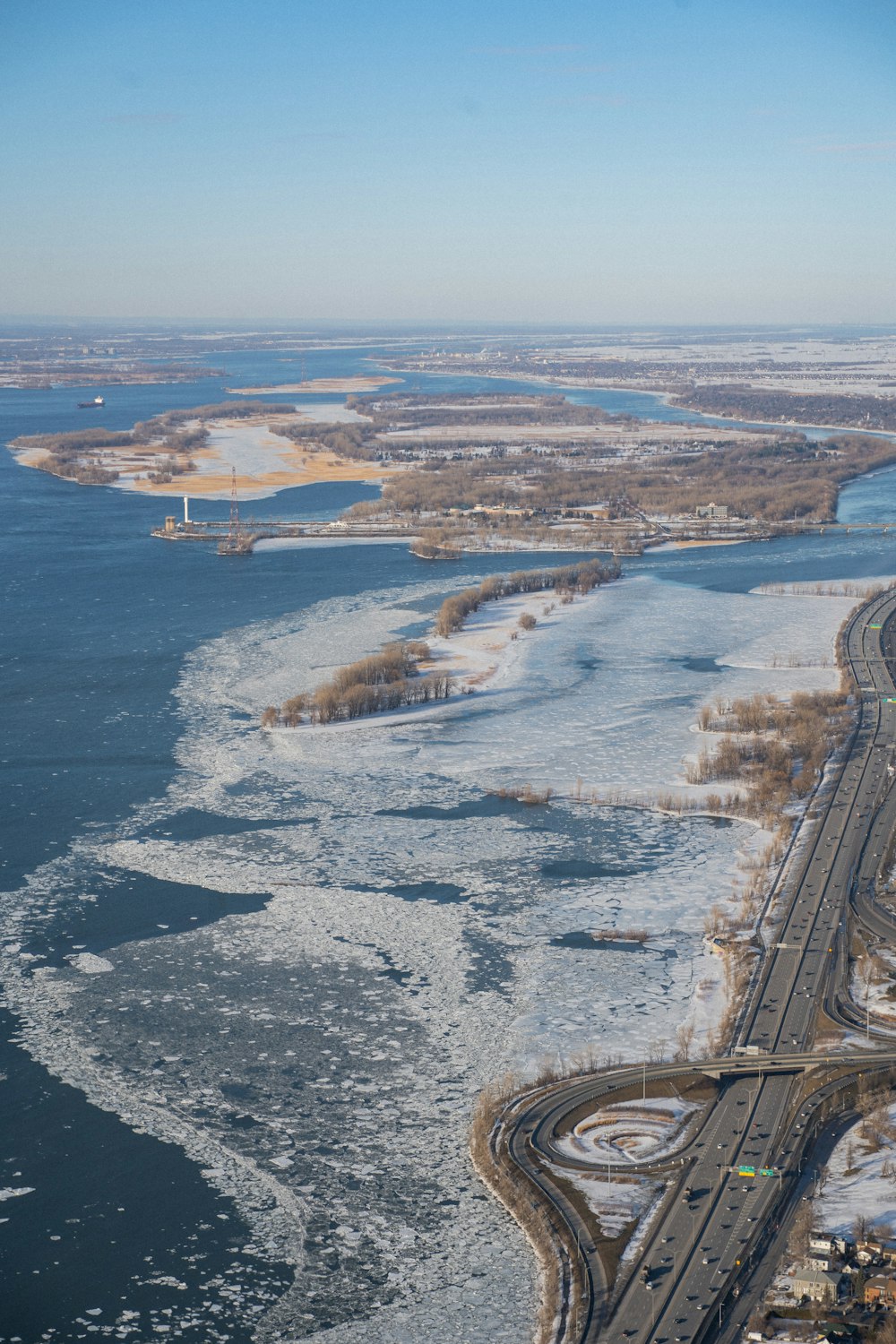 aerial view of city near body of water during daytime