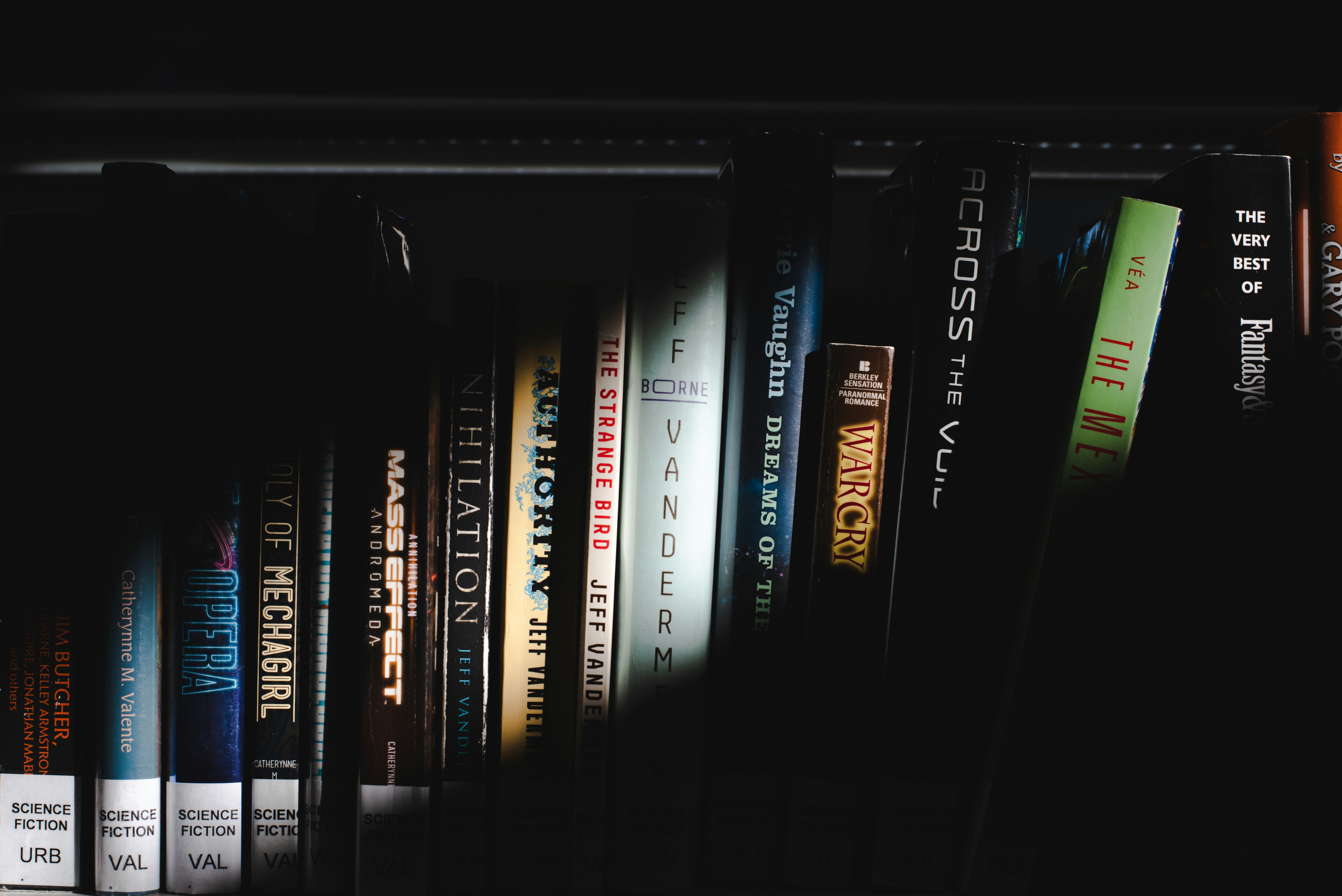 books on black wooden shelf