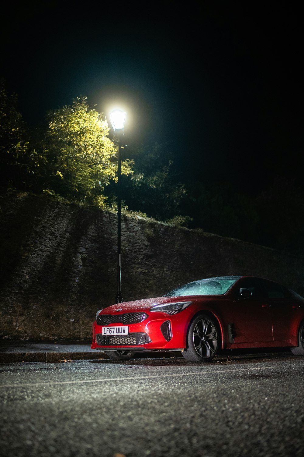 red ferrari 458 italia on road during night time