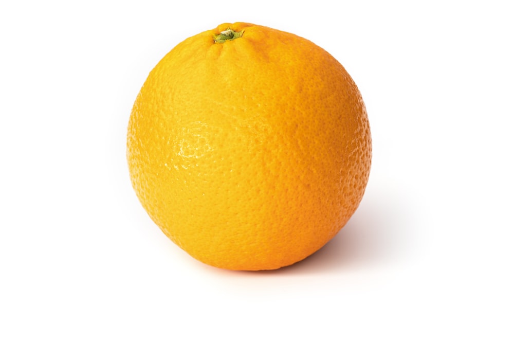 orange fruit on white surface