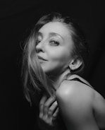 Artistic black and white portrait of the bride smiling softly.