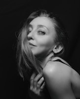 An artistic tintype portrait of a woman with vintage hairstyle and soft lighting.