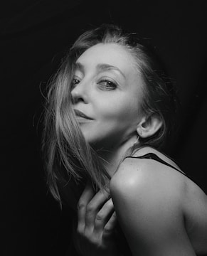Artistic black and white portrait of the bride smiling softly.
