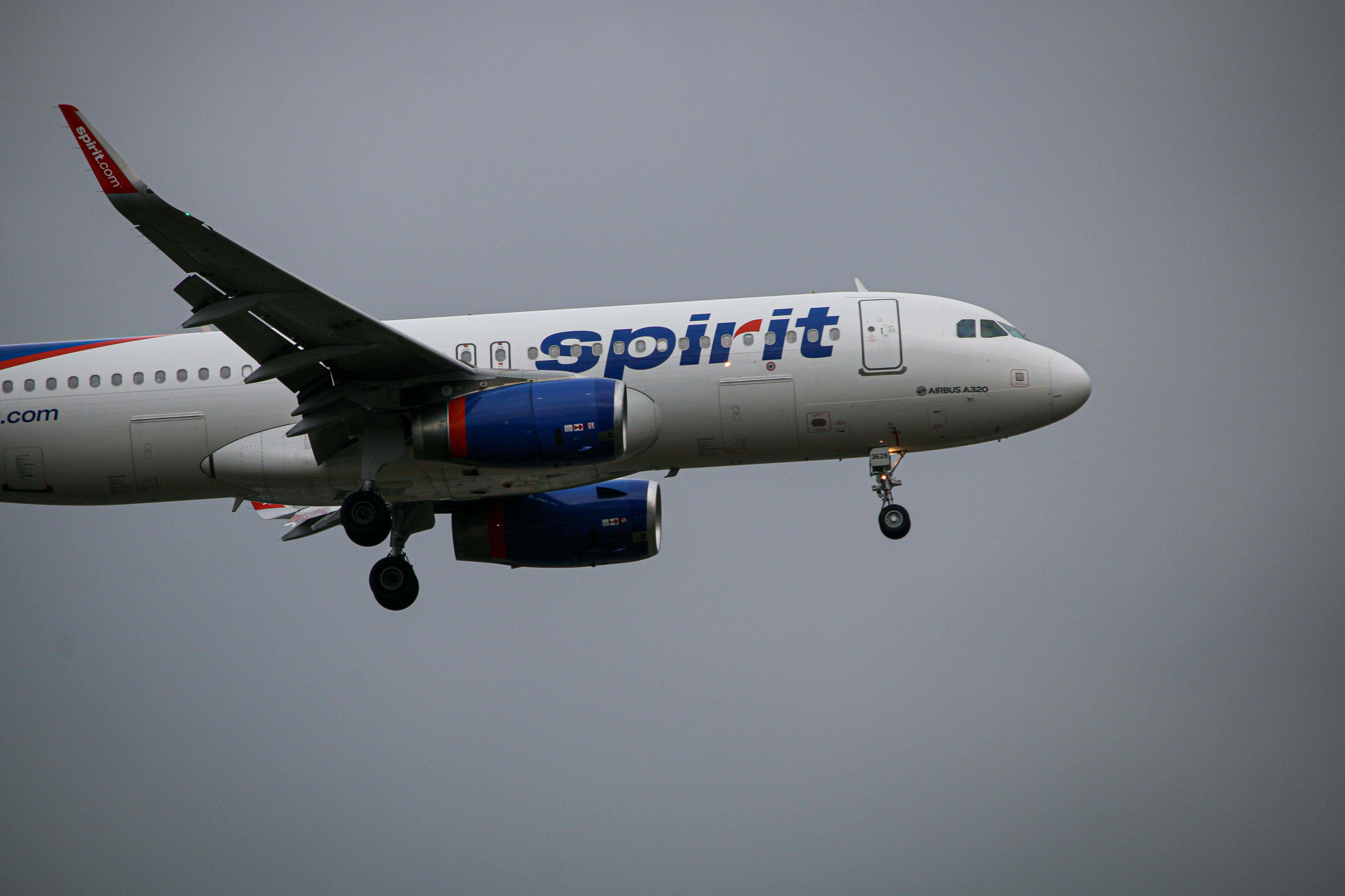 Spirit A320 in their old skittles livery on final for runway 22L.